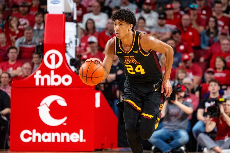 Feb 25, 2024; Lincoln, Nebraska, USA; Minnesota Golden Gophers guard Cam Christie (24) dribbles the ball against the Nebraska Cornhuskers during the second half at Pinnacle Bank Arena. Mandatory Credit: Dylan Widger-USA TODAY Sports