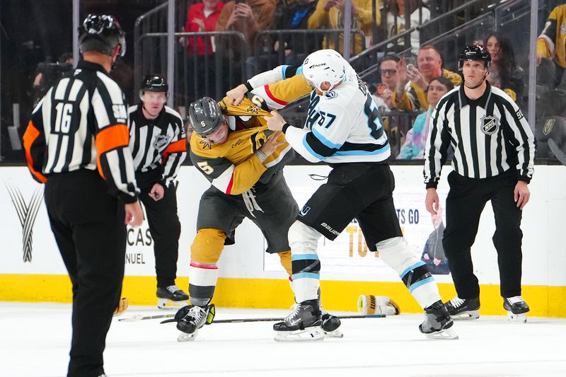 Mar 19, 2026; Las Vegas, Nevada, USA; Vegas Golden Knights defenseman Jeremy Lauzon (5) fights Utah Mammoth left wing Lawson Crouse (67) during the second period at T-Mobile Arena. Mandatory Credit: Stephen R. Sylvanie-Imagn Images
