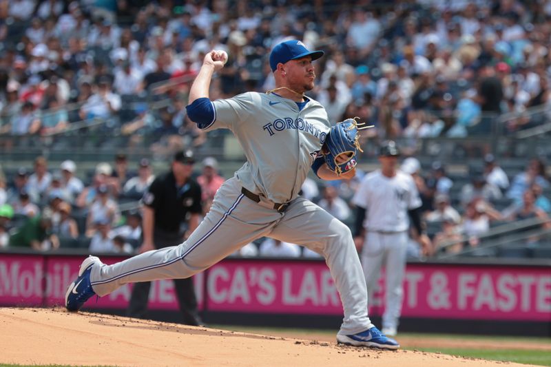 Aug 4, 2024; Bronx, New York, USA; Toronto Blue Jays starting pitcher Yariel Rodriguez (29) delivers a pitch during the first inning against the New York Yankees at Yankee Stadium. Mandatory Credit: Vincent Carchietta-USA TODAY Sports