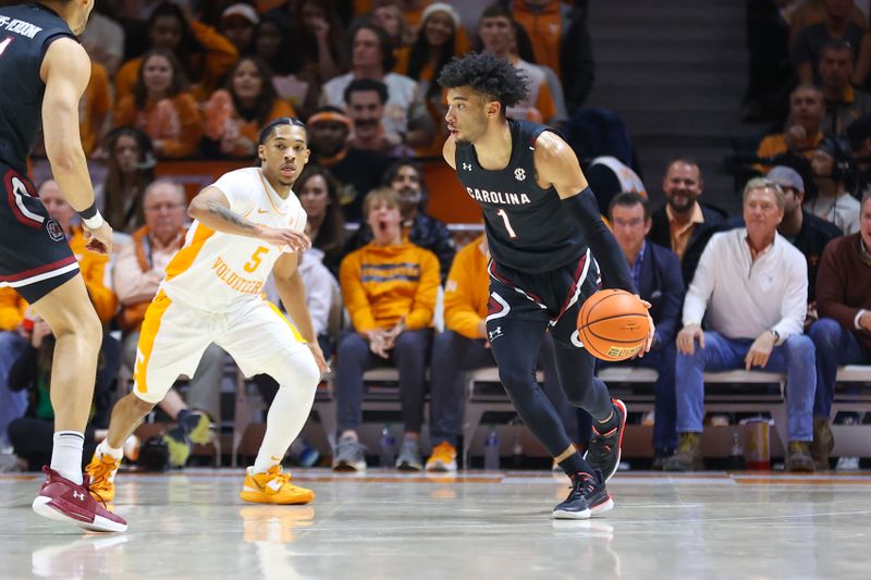 Feb 25, 2023; Knoxville, Tennessee, USA; South Carolina Gamecocks guard Jacobi Wright (1) moves the ball against Tennessee Volunteers guard Zakai Zeigler (5) during the first half at Thompson-Boling Arena. Mandatory Credit: Randy Sartin-USA TODAY Sports