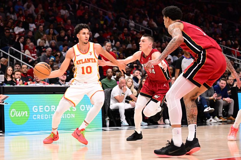 ATLANTA, GA - FEBRUARY 24: Zaccharie Risacher #10 of the Atlanta Hawks dribbles the ball during the game against the Miami Heat  on February 24, 2025 at State Farm Arena in Atlanta, Georgia.  NOTE TO USER: User expressly acknowledges and agrees that, by downloading and/or using this Photograph, user is consenting to the terms and conditions of the Getty Images License Agreement. Mandatory Copyright Notice: Copyright 2025 NBAE (Photo by Adam Hagy/NBAE via Getty Images)