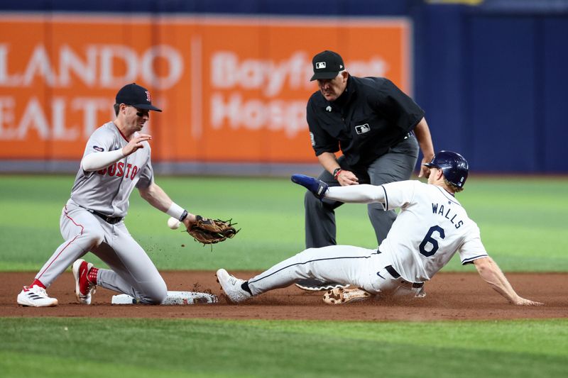 Sep 19, 2024; St. Petersburg, Florida, USA; Tampa Bay Rays shortstop Taylor Walls (6) steals second base on a errant throw to Boston Red Sox second baseman Nick Sogard (75) in the seventh inning at Tropicana Field. Mandatory Credit: Nathan Ray Seebeck-Imagn Images