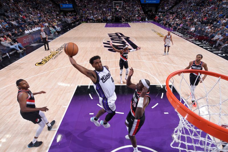 SACRAMENTO, CA - OCTOBER 13: Malik Monk #0 of the Sacramento Kings dunks the ball during the game against the Portland Trail Blazers during a NBA preseason game on October 13, 2024 at Golden 1 Center in Sacramento, California. NOTE TO USER: User expressly acknowledges and agrees that, by downloading and or using this Photograph, user is consenting to the terms and conditions of the Getty Images License Agreement. Mandatory Copyright Notice: Copyright 2024 NBAE (Photo by Rocky Widner/NBAE via Getty Images)