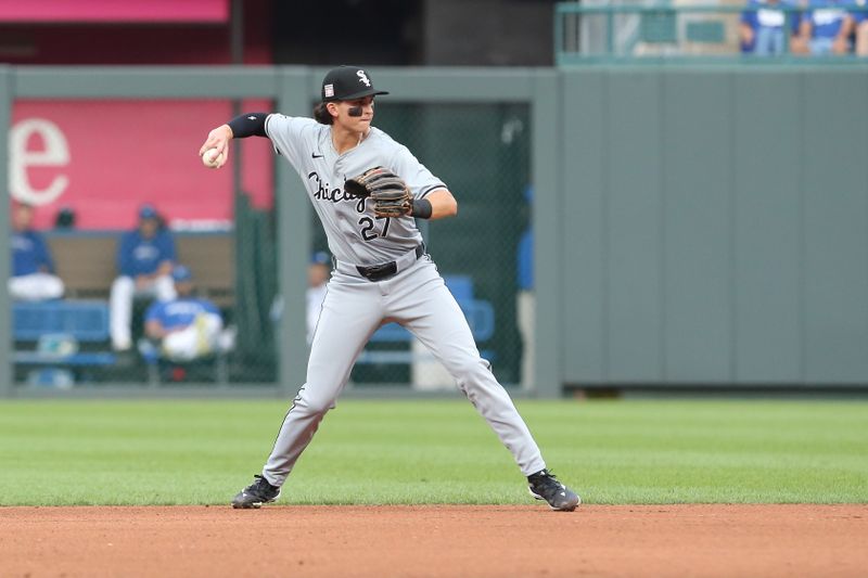 Jul 20, 2024; Kansas City, Missouri, USA; Chicago White Sox second baseman Brooks Baldwin (27) makes a throw to first base against the Kansas City Royals during the bottom of the third inning at Kauffman Stadium. Mandatory Credit: Scott Sewell-USA TODAY Sports