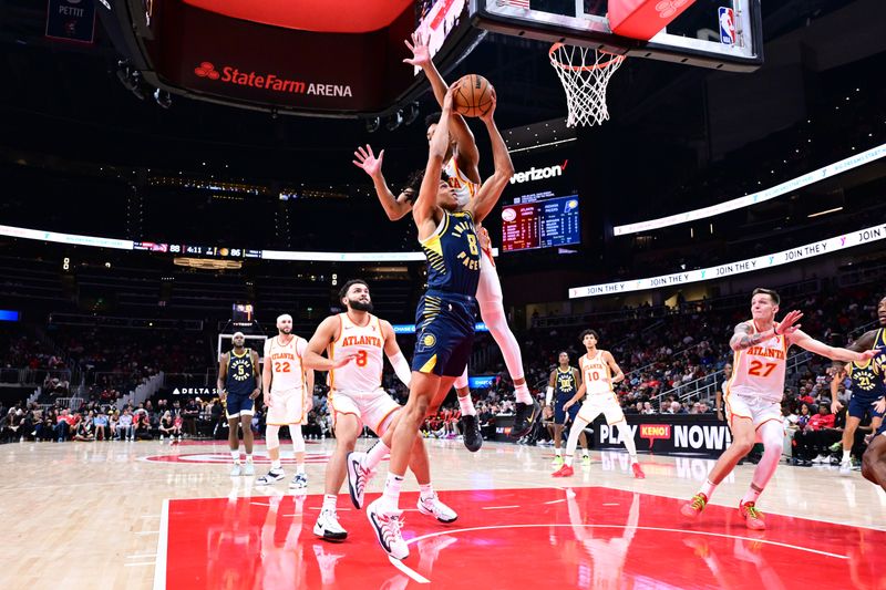 ATLANTA, GA - OCTOBER 8: Enrique Freeman #8 of the Indiana Pacers drives to the basket during the game against the Atlanta Hawks during a NBA preseason game on October 8, 2024 at State Farm Arena in Atlanta, Georgia.  NOTE TO USER: User expressly acknowledges and agrees that, by downloading and/or using this Photograph, user is consenting to the terms and conditions of the Getty Images License Agreement. Mandatory Copyright Notice: Copyright 2024 NBAE (Photo by Adam Hagy/NBAE via Getty Images)