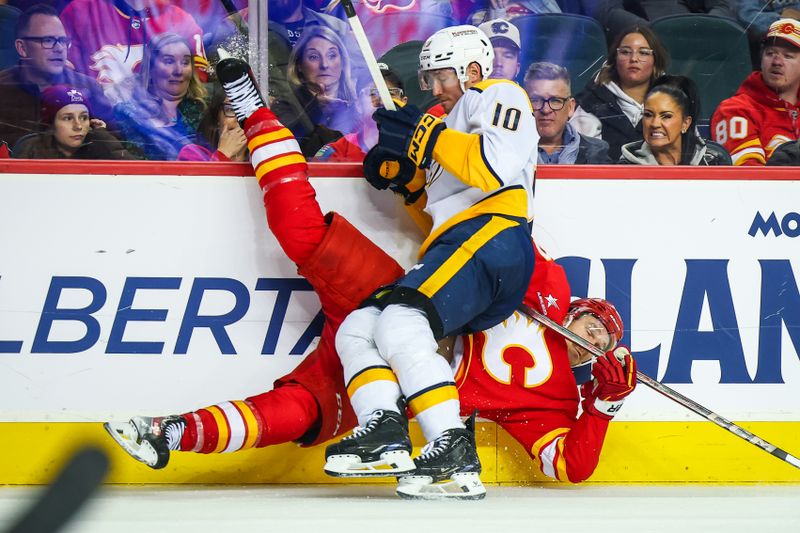 Nov 15, 2024; Calgary, Alberta, CAN; Nashville Predators center Colton Sissons (10) checks into the boards Calgary Flames center Jonathan Huberdeau (10) during the third period at Scotiabank Saddledome. Mandatory Credit: Sergei Belski-Imagn Images