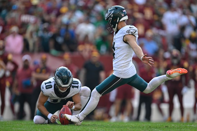 Philadelphia Eagles place kicker Jake Elliott kicks an extra point during the second half of an NFL football game against the Washington Commanders, Sunday, Oct. 29, 2023, in Landover, Md. (AP Photo/Terrance Williams)