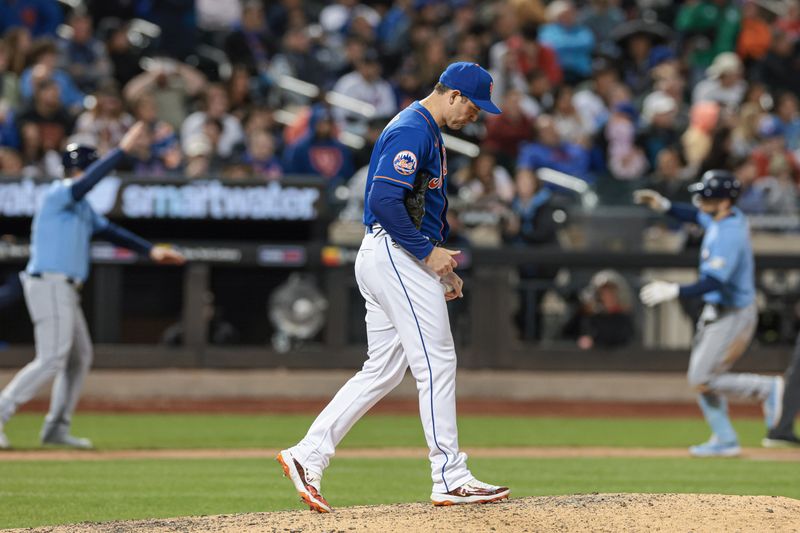 May 17, 2023; New York City, New York, USA; New York Mets relief pitcher Adam Ottavino (0) reacts after giving up a two run home run to Tampa Bay Rays second baseman Brandon Lowe (8) during the seventh inning at Citi Field. Mandatory Credit: Vincent Carchietta-USA TODAY Sports