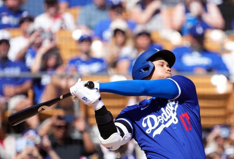 Mar 10, 2024; Phoenix, Arizona, USA; Los Angeles Dodgers designated hitter Shohei Ohtani (17) bats against the Arizona Diamondbacks during the sixth inning at Camelback Ranch-Glendale. Mandatory Credit: Joe Camporeale-USA TODAY Sports