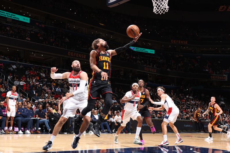 WASHINGTON, DC -? OCTOBER 30: Trae Young #11 of the Atlanta Hawks drives to the basket during the game against the Washington Wizards on October 30, 2024 at Capital One Arena in Washington, DC. NOTE TO USER: User expressly acknowledges and agrees that, by downloading and or using this Photograph, user is consenting to the terms and conditions of the Getty Images License Agreement. Mandatory Copyright Notice: Copyright 2024 NBAE (Photo by Stephen Gosling/NBAE via Getty Images)