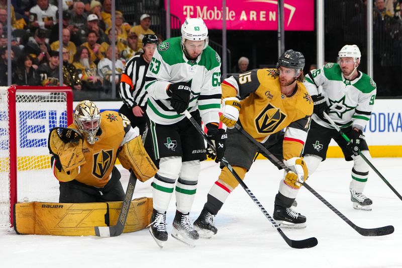 Apr 29, 2024; Las Vegas, Nevada, USA; Vegas Golden Knights goaltender Logan Thompson (36) makes a glove save behind defenseman Noah Hanafin (15) and Dallas Stars right wing Evgenii Dadonov (63) during the second period of game four of the first round of the 2024 Stanley Cup Playoffs at T-Mobile Arena. Mandatory Credit: Stephen R. Sylvanie-USA TODAY Sports