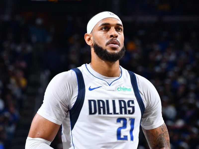 PHOENIX, AZ - NOVEMBER 12: Daniel Gafford #21 of the Dallas Mavericks looks on during the game against the Golden State Warriors during the Emirates NBA Cup game on November 12, 2024 at Footprint Center in Phoenix, Arizona. NOTE TO USER: User expressly acknowledges and agrees that, by downloading and or using this photograph, user is consenting to the terms and conditions of the Getty Images License Agreement. Mandatory Copyright Notice: Copyright 2024 NBAE (Photo by Barry Gossage/NBAE via Getty Images)