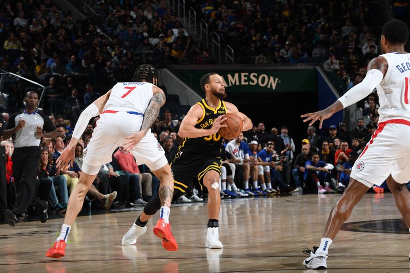 SAN FRANCISCO, CA - FEBRUARY 14: Stephen Curry #30 of the Golden State Warriors looks to pass the ball during the game against the LA Clippers on FEBRUARY 14, 2024 at Chase Center in San Francisco, California. NOTE TO USER: User expressly acknowledges and agrees that, by downloading and or using this photograph, user is consenting to the terms and conditions of Getty Images License Agreement. Mandatory Copyright Notice: Copyright 2024 NBAE (Photo by Noah Graham/NBAE via Getty Images)