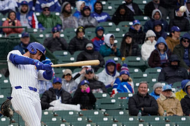 Apr 7, 2024; Chicago, Illinois, USA; Chicago Cubs outfielder Cody Bellinger (24) hits a home run against the Los Angeles Dodgers during the sixth inning at Wrigley Field. Mandatory Credit: David Banks-USA TODAY Sports