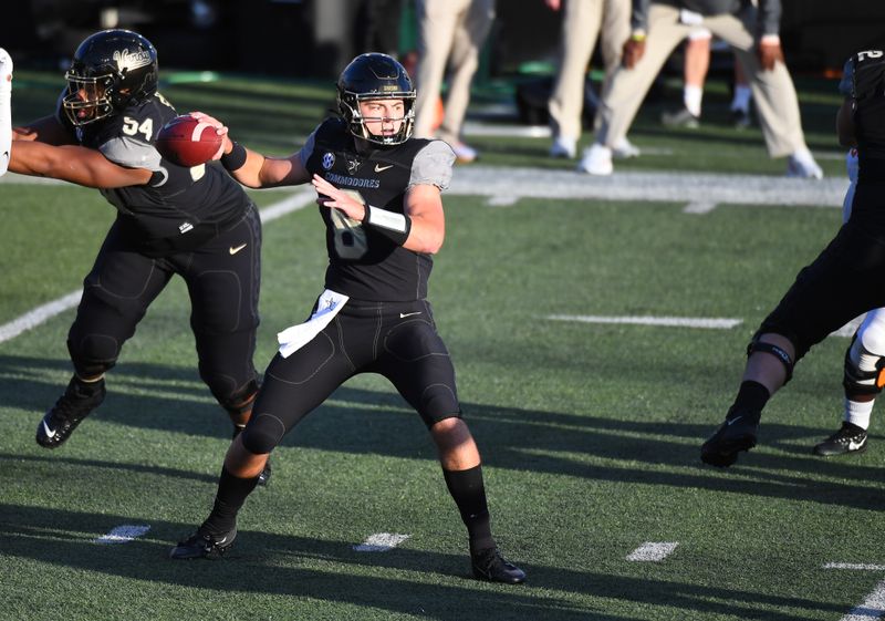 Dec 12, 2020; Nashville, Tennessee, USA; Vanderbilt Commodores quarterback Ken Seals (8) attempts a pass during the first half against the Tennessee Volunteers at Vanderbilt Stadium. Mandatory Credit: Christopher Hanewinckel-USA TODAY Sports