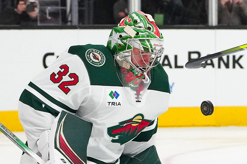 Feb 12, 2024; Las Vegas, Nevada, USA; Minnesota Wild goaltender Filip Gustavsson (32) makes a save against the Vegas Golden Knights during the third period at T-Mobile Arena. Mandatory Credit: Stephen R. Sylvanie-USA TODAY Sports