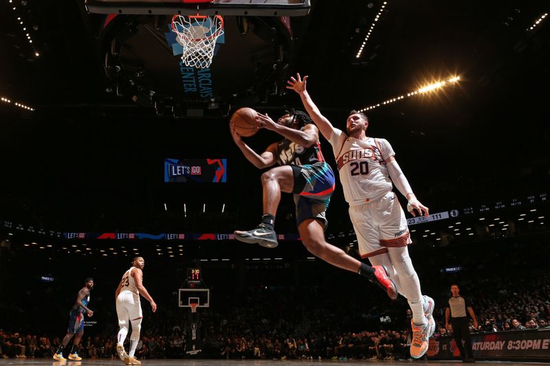 BROOKLYN, NY - JANUARY 31: Cam Thomas #24 of the Brooklyn Nets drives to the basket during the game against the Phoenix Suns on January 31, 2024 at Barclays Center in Brooklyn, New York. NOTE TO USER: User expressly acknowledges and agrees that, by downloading and or using this Photograph, user is consenting to the terms and conditions of the Getty Images License Agreement. Mandatory Copyright Notice: Copyright 2024 NBAE (Photo by Nathaniel S. Butler/NBAE via Getty Images)