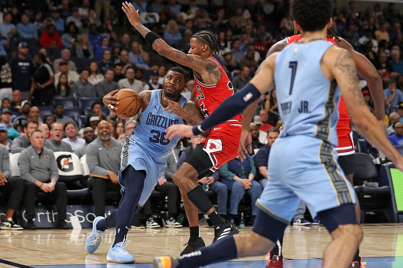 MEMPHIS, TENNESSEE - OCTOBER 28: Marcus Smart #36 of the Memphis Grizzlies goes to the basket against Dalen Terry #25 of the Chicago Bulls during the first half at FedExForum on October 28, 2024 in Memphis, Tennessee. NOTE TO USER: User expressly acknowledges and agrees that, by downloading and or using this photograph, User is consenting to the terms and conditions of the Getty Images License Agreement. (Photo by Justin Ford/Getty Images)