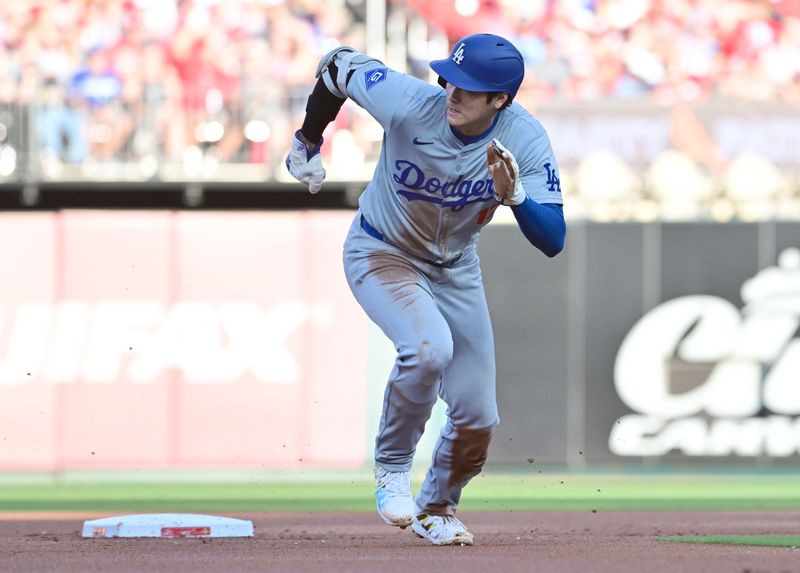 Aug 17, 2024; St. Louis, Missouri, USA; Los Angeles Dodgers designated hitter Shohei Ohtani (17) digs for third base against the St. Louis Cardinals in the first inning at Busch Stadium. Mandatory Credit: Tim Vizer-USA TODAY Sports