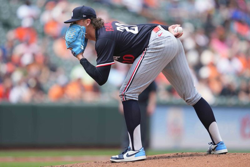 May 15, 2025; Baltimore, Maryland, USA; Minnesota Twins pitcher Chris Paddack (20) looks for the catchers signs during the third inning against the Baltimore Orioles at Oriole Park at Camden Yards. Mandatory Credit: Mitch Stringer-Imagn Images