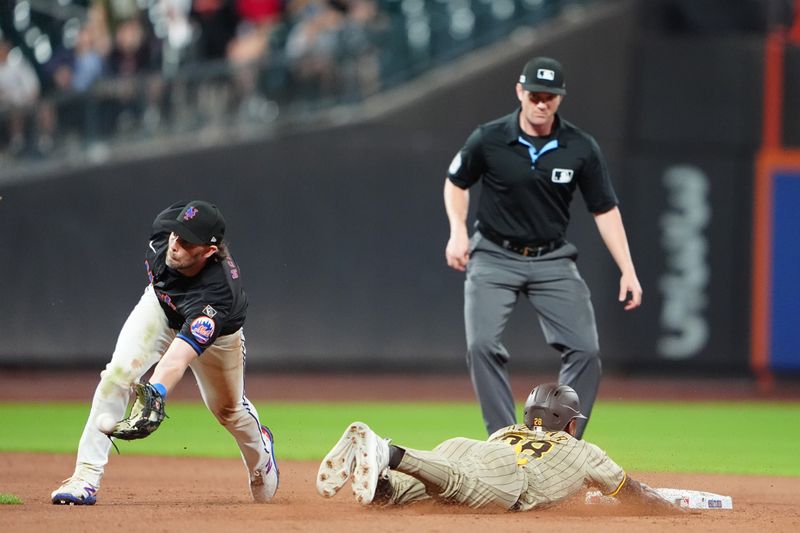 Jun 14, 2024; New York City, New York, USA;  San Diego Padres left fielder Jose Azocar (28) steals second base with New York Mets second baseman Jeff McNeil (1) receiving the throw during the ninth inning at Citi Field. Mandatory Credit: Gregory Fisher-USA TODAY Sports