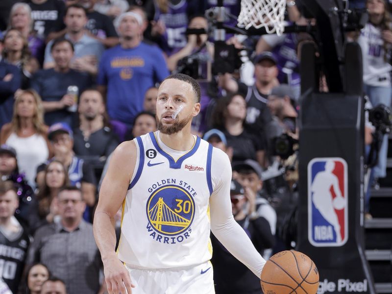 SACRAMENTO, CA - APRIL 17:  Stephen Curry #30 of the Golden State Warriors dribbles the ball against the Sacramento Kings during Round 1 Game 2 of the 2023 NBA Playoffs on April 17, 2023 at Golden 1 Center in Sacramento, California. NOTE TO USER: User expressly acknowledges and agrees that, by downloading and or using this Photograph, user is consenting to the terms and conditions of the Getty Images License Agreement. Mandatory Copyright Notice: Copyright 2023 NBAE (Photo by Rocky Widner/NBAE via Getty Images)