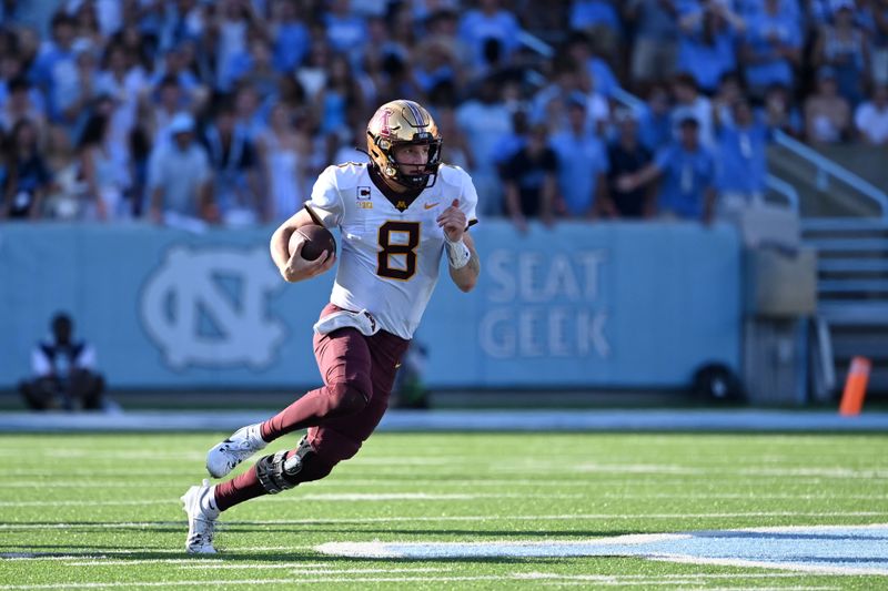 Sep 16, 2023; Chapel Hill, North Carolina, USA; Minnesota Golden Gophers quarterback Athan Kaliakmanis (8) with the ball in the third quarter at Kenan Memorial Stadium. Mandatory Credit: Bob Donnan-USA TODAY Sports