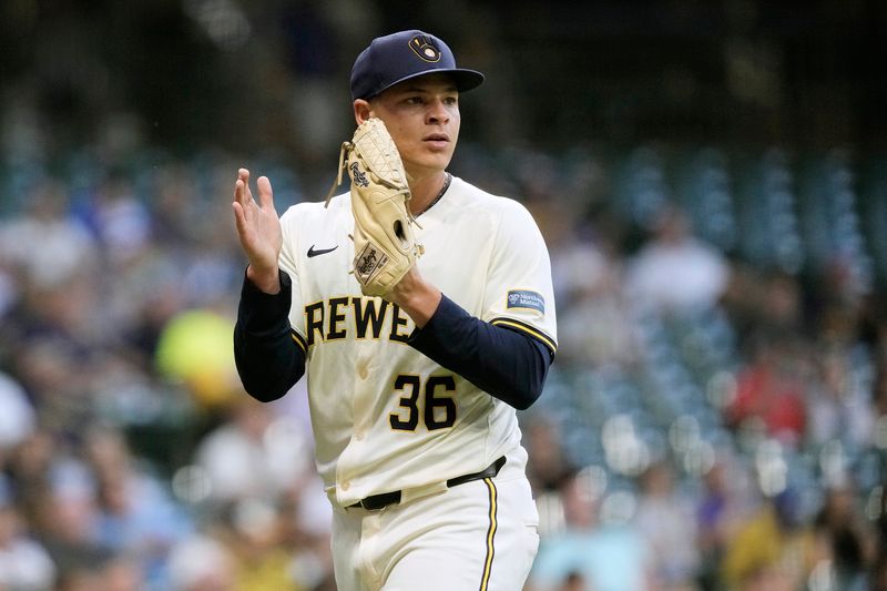 Jul 10, 2024; Milwaukee, Wisconsin, USA;  Milwaukee Brewers pitcher Tobias Myers (36) applauds a play to end the fourth inning against the Pittsburgh Pirates at American Family Field. Mandatory Credit: Jeff Hanisch-USA TODAY Sports