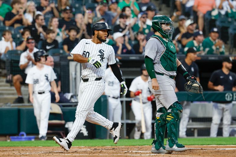 Sep 14, 2024; Chicago, Illinois, USA; Chicago White Sox third baseman Lenyn Sosa (50) scores against the Oakland Athletics during the second inning at Guaranteed Rate Field. Mandatory Credit: Kamil Krzaczynski-Imagn Images