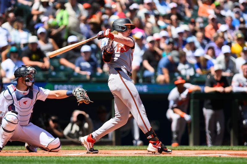 Jul 4, 2024; Seattle, Washington, USA; Baltimore Orioles designated hitter Heston Kjerstad (13) hits a single against the Seattle Mariners during the first inning at T-Mobile Park. Mandatory Credit: Steven Bisig-USA TODAY Sports