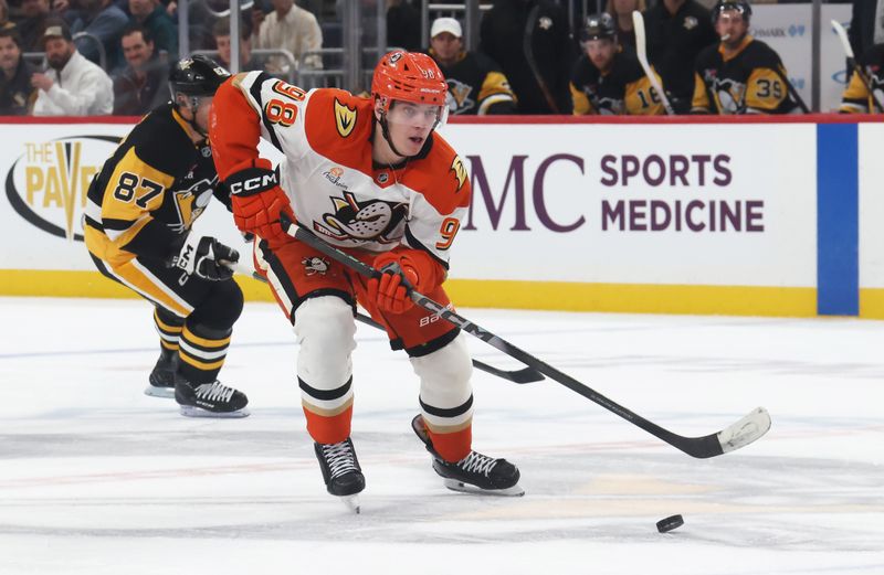 Dec 9, 2025; Pittsburgh, Pennsylvania, USA;  Anaheim Ducks defenseman Pavel Mintyukov (98) skates with the puck against the Pittsburgh Penguins during the second period at PPG Paints Arena. Mandatory Credit: Charles LeClaire-Imagn Images