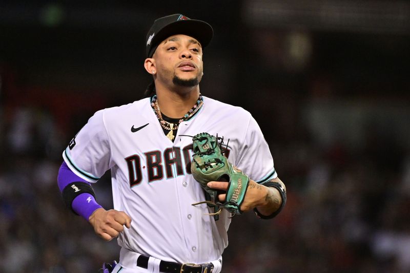 Oct 11, 2023; Phoenix, Arizona, USA; Arizona Diamondbacks second baseman Ketel Marte (4) during the third inning for game three of the NLDS for the 2023 MLB playoffs against the Los Angeles Dodgers at Chase Field. Mandatory Credit: Matt Kartozian-USA TODAY Sports