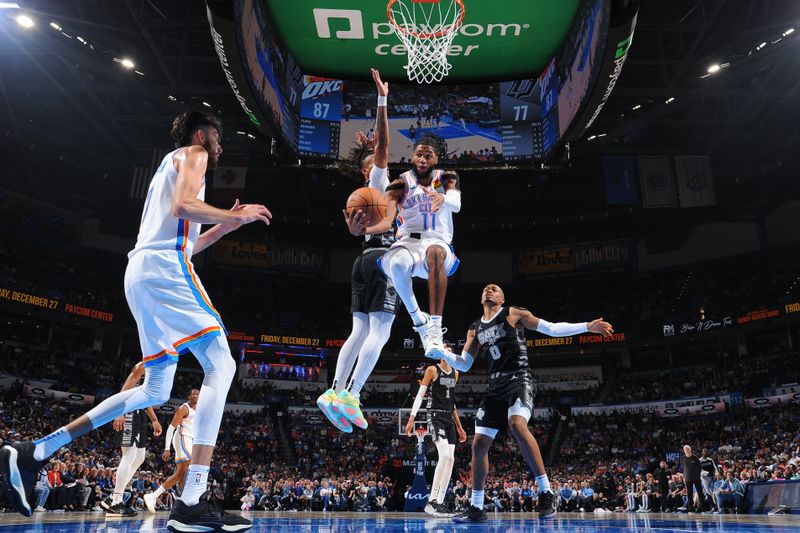 OKLAHOMA CITY, OK - OCTOBER 30: Isaiah Joe #11 of the Oklahoma City Thunder drives to the basket during the game against the San Antonio Spurs on October 30, 2024 at Paycom Center in Oklahoma City, Oklahoma. NOTE TO USER: User expressly acknowledges and agrees that, by downloading and or using this photograph, User is consenting to the terms and conditions of the Getty Images License Agreement. Mandatory Copyright Notice: Copyright 2024 NBAE (Photo by Brian Babineau/NBAE via Getty Images)