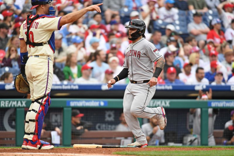 May 4, 2025; Philadelphia, Pennsylvania, USA; Arizona Diamondbacks catcher Jose Herrera (11) scores a run during the fourth inning against the Philadelphia Phillies at Citizens Bank Park. Mandatory Credit: Eric Hartline-Imagn Images