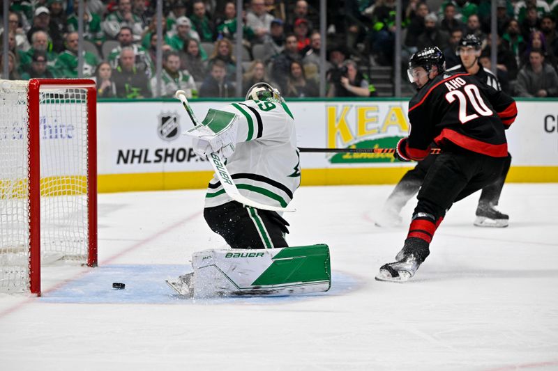 Jan 25, 2023; Dallas, Texas, USA; Carolina Hurricanes center Sebastian Aho (20) scores a shorthanded goal against Dallas Stars goaltender Jake Oettinger (29) during the first period at the American Airlines Center. Mandatory Credit: Jerome Miron-USA TODAY Sports