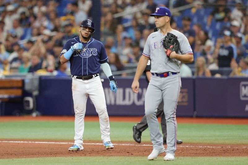 Oct 4, 2023; St. Petersburg, Florida, USA; Tampa Bay Rays third baseman Isaac Paredes (17) reacts after his single against the Texas Rangers in the seventh inning during game two of the Wildcard series for the 2023 MLB playoffs at Tropicana Field. Mandatory Credit: Nathan Ray Seebeck-USA TODAY Sports