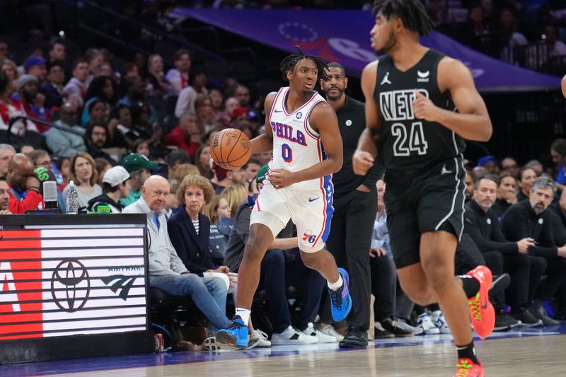 PHILADELPHIA, PA - APRIL 14: Tyrese Maxey #0 of the Philadelphia 76ers dribbles the ball during the game Brooklyn Nets on April 14, 2024 at the Wells Fargo Center in Philadelphia, Pennsylvania NOTE TO USER: User expressly acknowledges and agrees that, by downloading and/or using this Photograph, user is consenting to the terms and conditions of the Getty Images License Agreement. Mandatory Copyright Notice: Copyright 2024 NBAE (Photo by Jesse D. Garrabrant/NBAE via Getty Images)