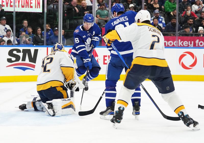 Dec 9, 2023; Toronto, Ontario, CAN; Toronto Maple Leafs right wing Mitchell Marner (16) jumps out of the way of a puck in front of goaltender Kevin Lankinen (32) during the third period at Scotiabank Arena. Mandatory Credit: Nick Turchiaro-USA TODAY Sports