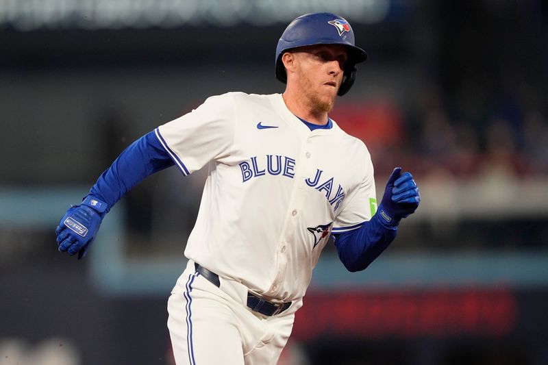 Jun 5, 2025; Toronto, Ontario, CAN; Toronto Blue Jays center fielder Myles Straw (3) runs to home to score on a double hit by catcher Tyler Heineman (not pictured) during the second inning against the Philadelphia Phillies at Rogers Centre. Mandatory Credit: John E. Sokolowski-Imagn Images