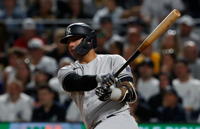 Sep 16, 2023; Pittsburgh, Pennsylvania, USA;  New York Yankees second baseman Gleyber Torres (25) hits a double  the Pittsburgh Pirates during the sixth inning at PNC Park. Mandatory Credit: Charles LeClaire-USA TODAY Sports