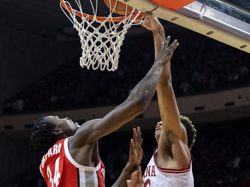 Jan 28, 2023; Bloomington, Indiana, USA; Indiana Hoosiers forward Trayce Jackson-Davis (23) shoots the ball while Ohio State Buckeyes center Felix Okpara (34) defends in the first half at Simon Skjodt Assembly Hall. Mandatory Credit: Trevor Ruszkowski-USA TODAY Sports