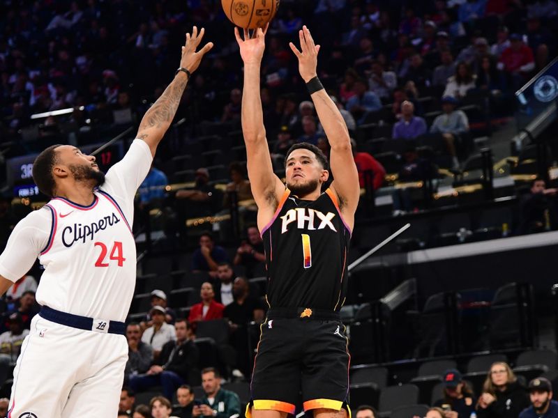 INGLEWOOD, CA - OCTOBER 31: Devin Booker #1 of the Phoenix Suns shoots a three point basket during the game against the LA Clippers on October 31, 2024 at Intuit Dome in Los Angeles, California. NOTE TO USER: User expressly acknowledges and agrees that, by downloading and/or using this Photograph, user is consenting to the terms and conditions of the Getty Images License Agreement. Mandatory Copyright Notice: Copyright 2024 NBAE (Photo by Adam Pantozzi/NBAE via Getty Images)