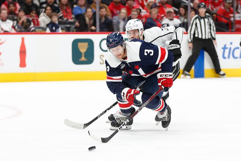 Jan 7, 2024; Washington, District of Columbia, USA; Washington Capitals defenseman Nick Jensen (3) reaches for the puck in front of Los Angeles Kings defenseman Matt Roy (3) during the first period at Capital One Arena. Mandatory Credit: Amber Searls-USA TODAY Sports