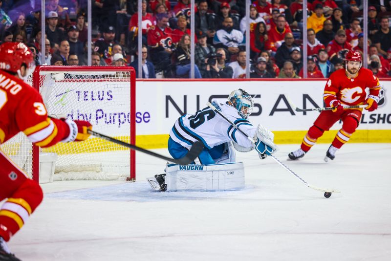 Apr 12, 2023; Calgary, Alberta, CAN; San Jose Sharks goaltender Kaapo Kahkonen (36) makes a save against the Calgary Flames during the second period at Scotiabank Saddledome. Mandatory Credit: Sergei Belski-USA TODAY Sports