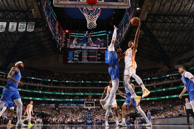 DALLAS, TX - APRIL 4: De'Andre Hunter #12 of the Atlanta Hawks goes to the basket during the game on April 4, 2024 at the American Airlines Center in Dallas, Texas. NOTE TO USER: User expressly acknowledges and agrees that, by downloading and or using this photograph, User is consenting to the terms and conditions of the Getty Images License Agreement. Mandatory Copyright Notice: Copyright 2024 NBAE (Photo by Glenn James/NBAE via Getty Images)