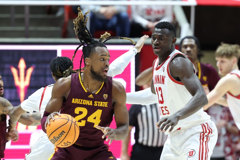 Feb 10, 2024; Salt Lake City, Utah, USA; Arizona State Sun Devils forward Bryant Selebangue (24) moves the ball against Utah Utes center Keba Keita (13) during the second half at Jon M. Huntsman Center. Mandatory Credit: Rob Gray-USA TODAY Sports