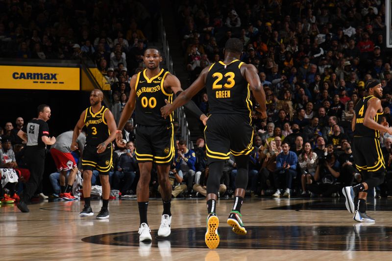 SAN FRANCISCO, CA - MARCH 7: Jonathan Kuminga #00 high fives  Draymond Green #23 of the Golden State Warriors during the game against the Chicago Bulls on March 7, 2024 at Chase Center in San Francisco, California. NOTE TO USER: User expressly acknowledges and agrees that, by downloading and or using this photograph, user is consenting to the terms and conditions of Getty Images License Agreement. Mandatory Copyright Notice: Copyright 2024 NBAE (Photo by Noah Graham/NBAE via Getty Images)