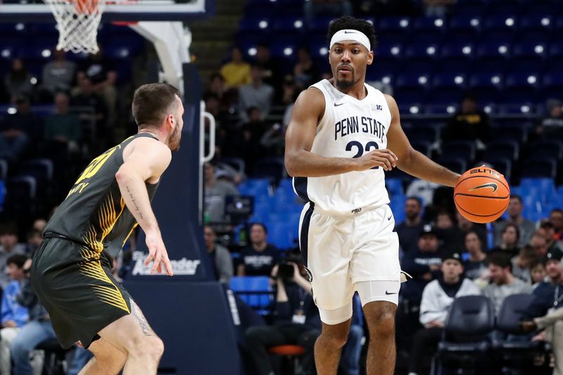 Jan 1, 2023; University Park, Pennsylvania, USA; Penn State Nittany Lions guard Jalen Pickett (22) dribbles the ball during the first half against the Iowa Hawkeyes at Bryce Jordan Center. Penn State defeated Iowa 83-79. Mandatory Credit: Matthew OHaren-USA TODAY Sports