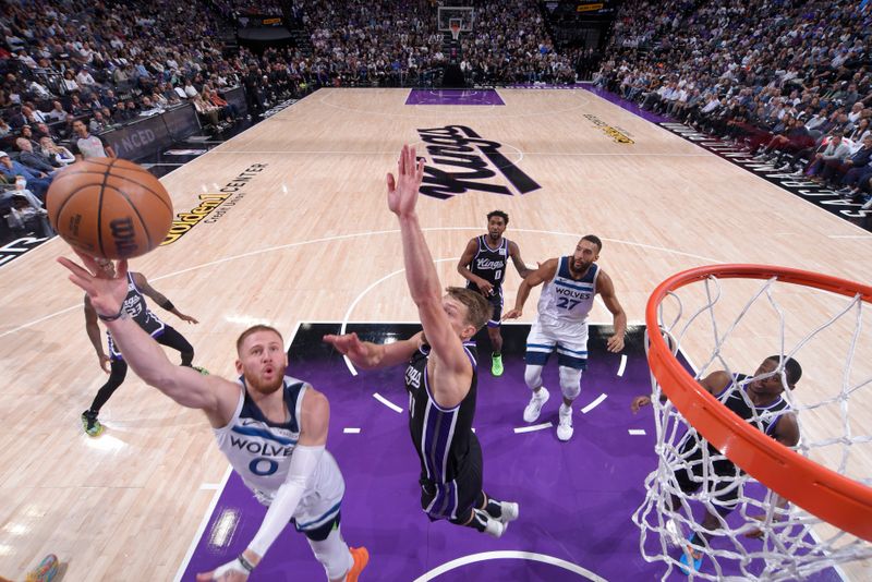 SACRAMENTO, CA - OCTOBER 24: Donte DiVincenzo #0 of the Minnesota Timberwolves drives to the basket during the game against the Sacramento Kings on October 24, 2024 at Golden 1 Center in Sacramento, California. NOTE TO USER: User expressly acknowledges and agrees that, by downloading and or using this Photograph, user is consenting to the terms and conditions of the Getty Images License Agreement. Mandatory Copyright Notice: Copyright 2024 NBAE (Photo by Rocky Widner/NBAE via Getty Images)