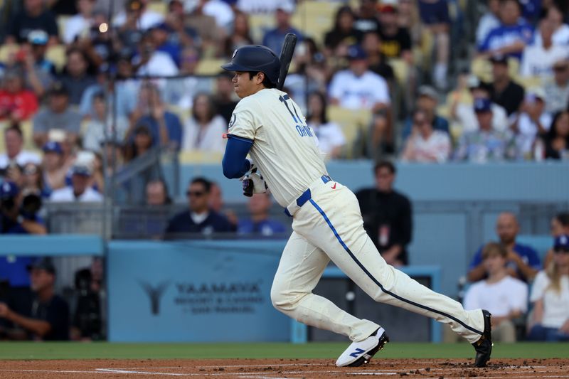 Aug 10, 2024; Los Angeles, California, USA;  Los Angeles Dodgers designated hitter Shohei Ohtani (17) grounds out to first during the first inning against the Pittsburgh Pirates at Dodger Stadium. Mandatory Credit: Kiyoshi Mio-USA TODAY Sports